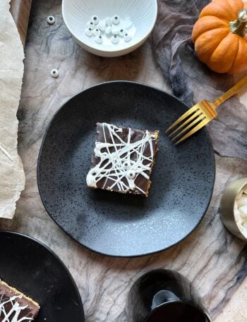 black plate with spiderweb smores bars