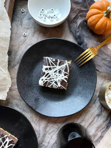 black plate with spiderweb smores bars