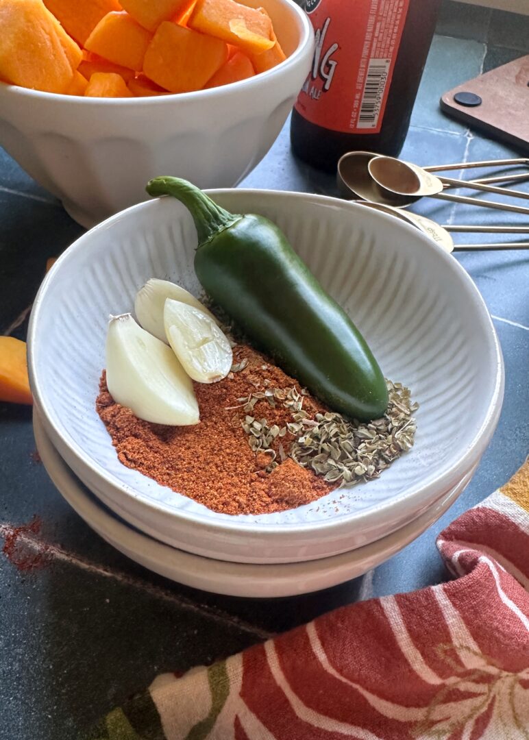 bowl of spices used in autumn harvest chili