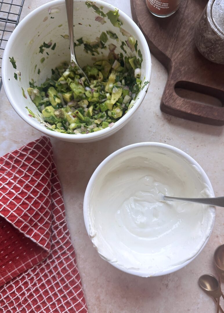 bowls of lime crema and avocado salsa