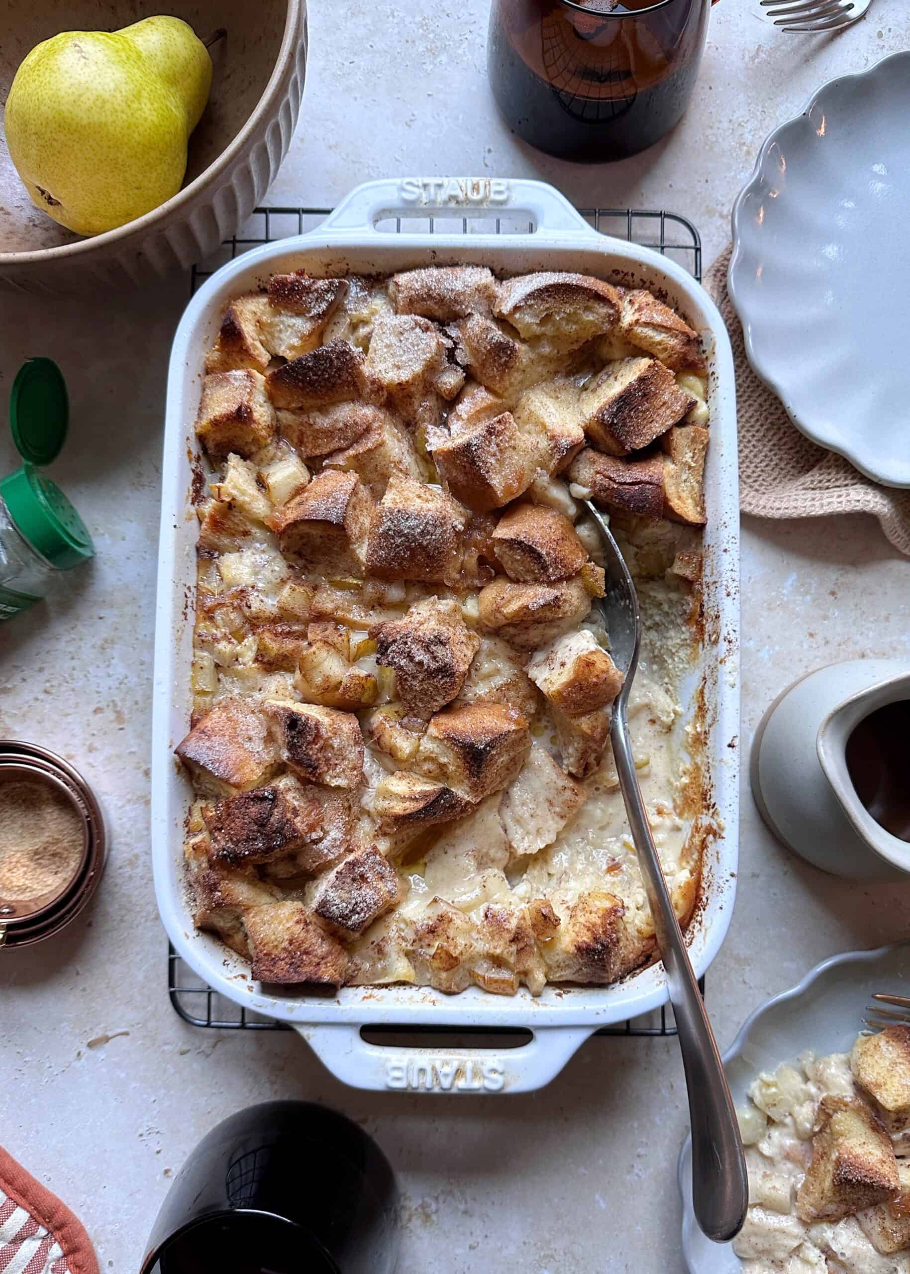 challah baked pear french toast with serving spoon