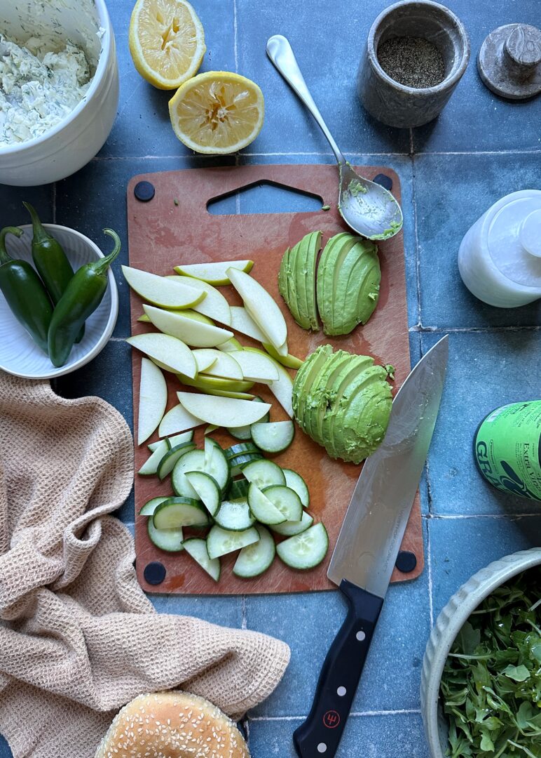 chopped cucumber avocado and green apple on cutting board