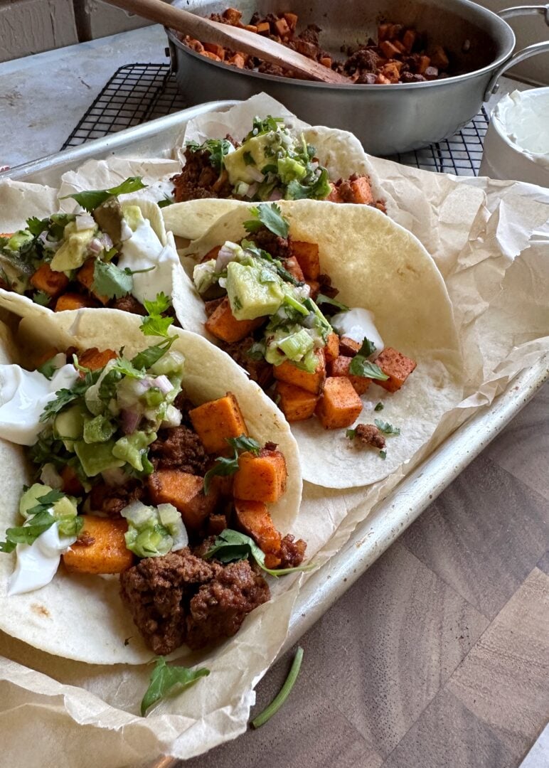 chorizo sweet potato tacos with avocado salsa and lime crema