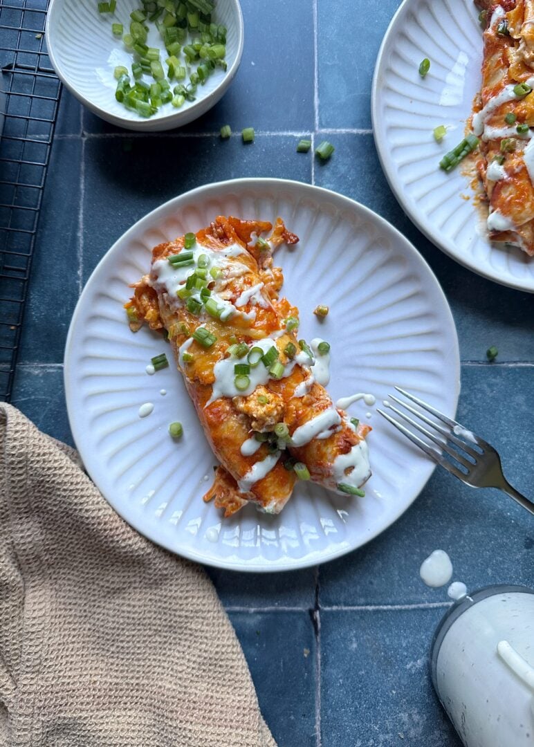 plate of buffalo chicken enchiladas with ranch dressing