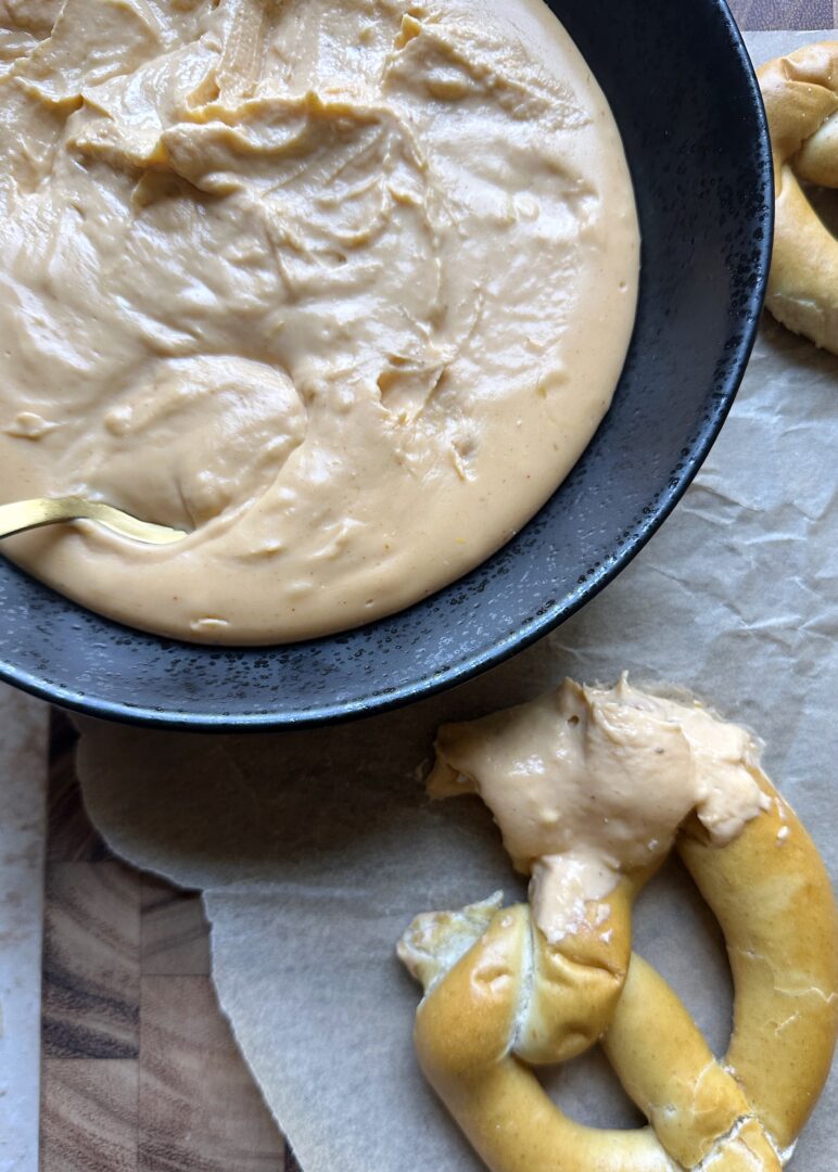 pumpkin beer cheese with dipped soft pretzel on the side