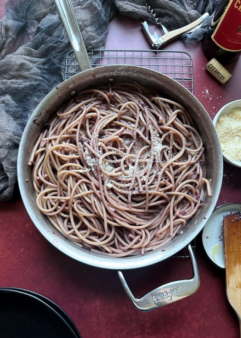 saute pan with red wine drunken noodles and parmesan cheese