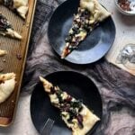 slices of black lagoon pizza on plates