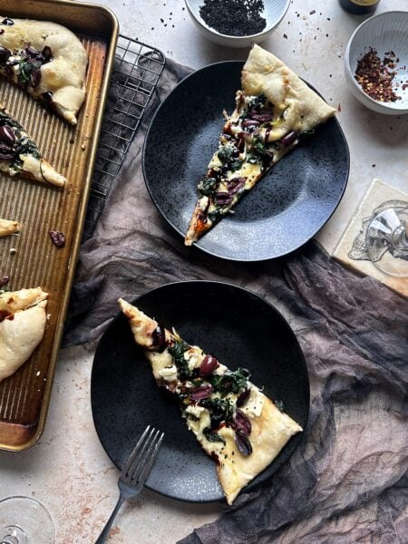slices of black lagoon pizza on plates