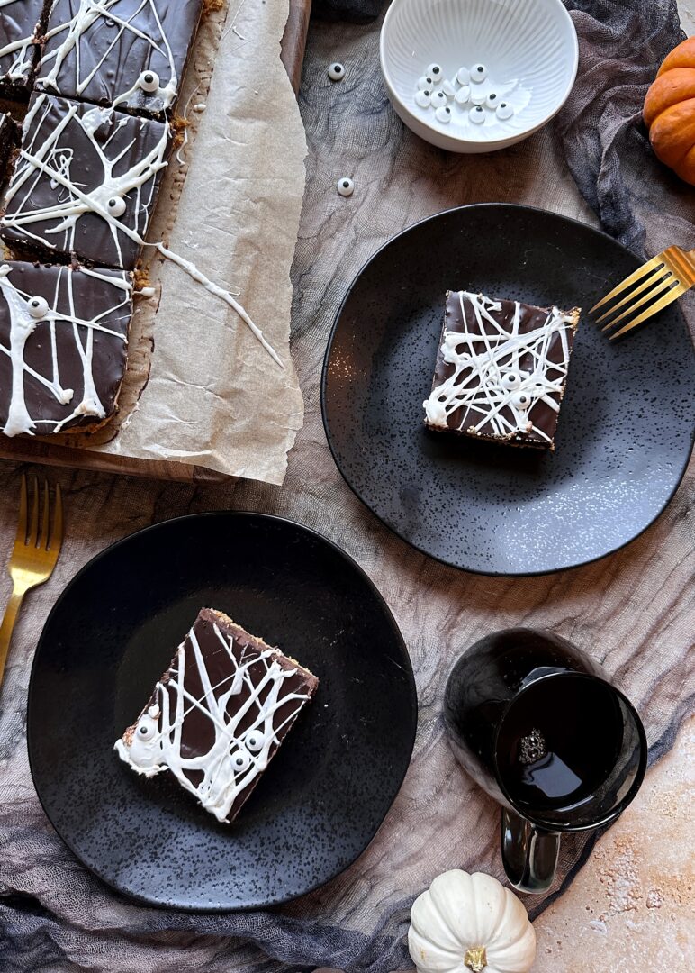 two plates of spiderweb smores bars