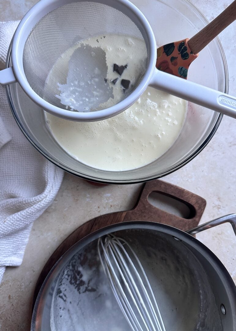 warmed heavy cream poured into bowl