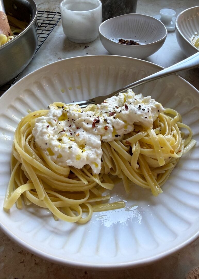 bowl of stracciatella pasta with silver fork
