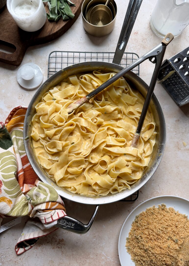 brown butter pumpkin alfredo with noodles in frying pan