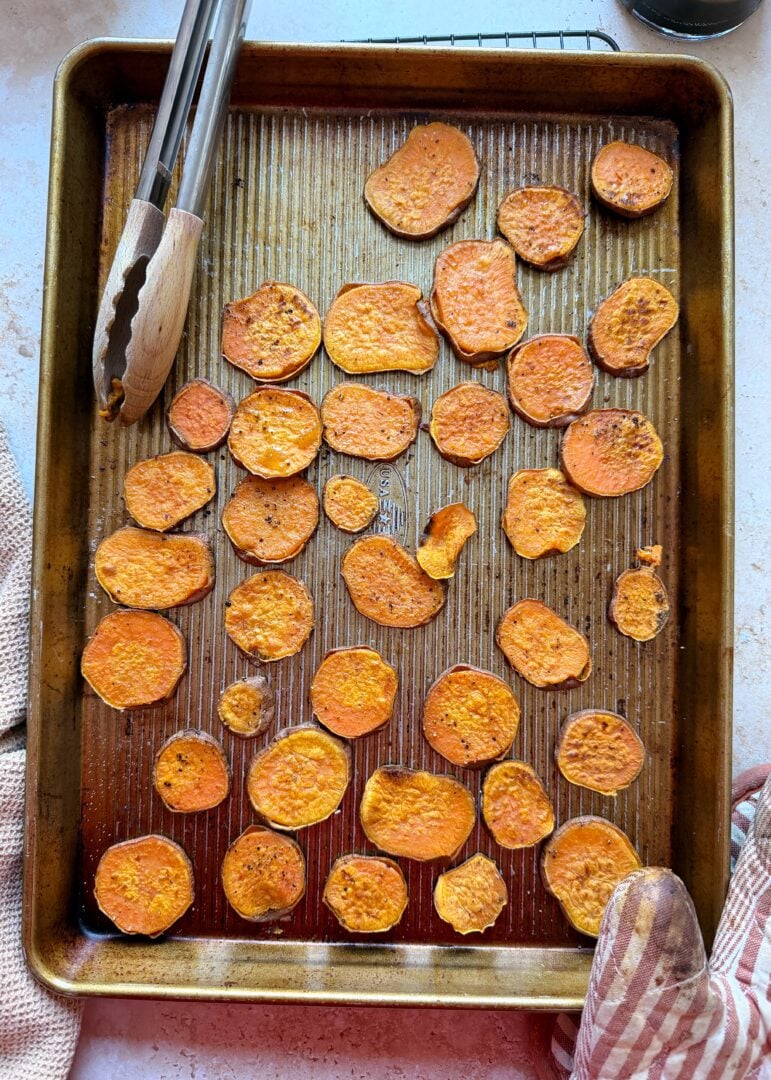 baking sheet with thinly sliced roasted sweet potatoes