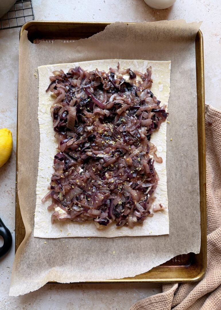 caramelized onion and boursin tart before baking