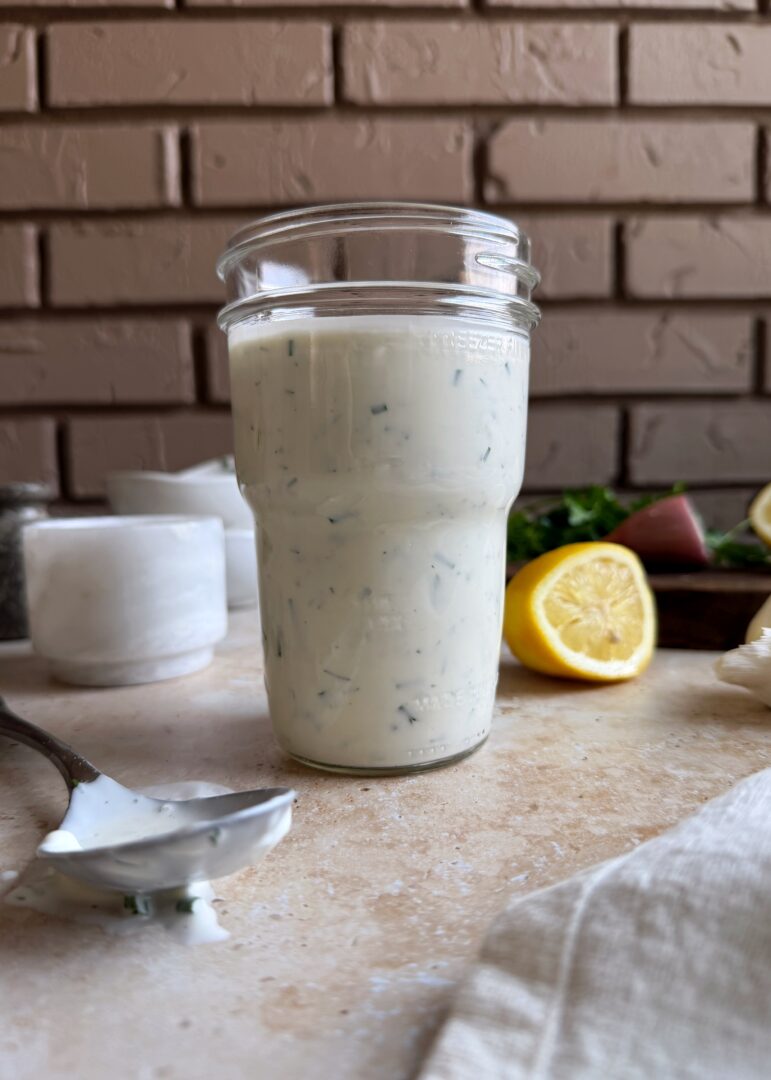 glass jar of herby ranch dressing