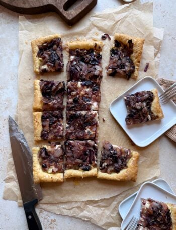 servings of caramelized onion and boursin tart with some pieces plated