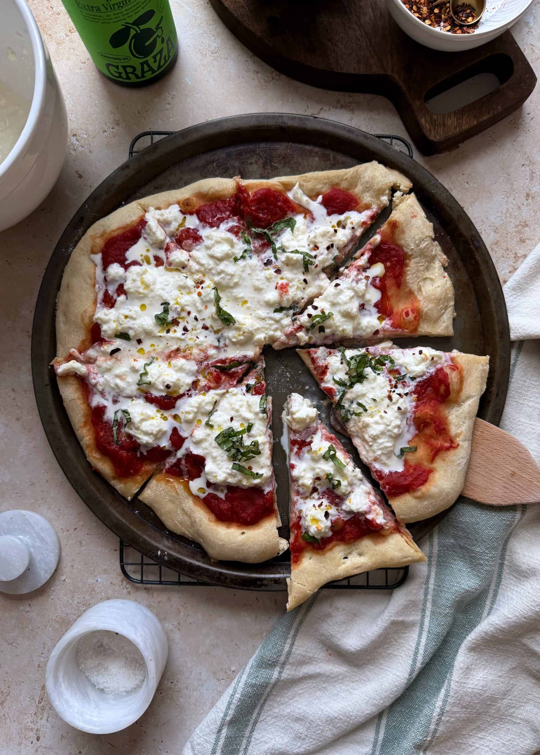 stracciatella pizza cut into slices