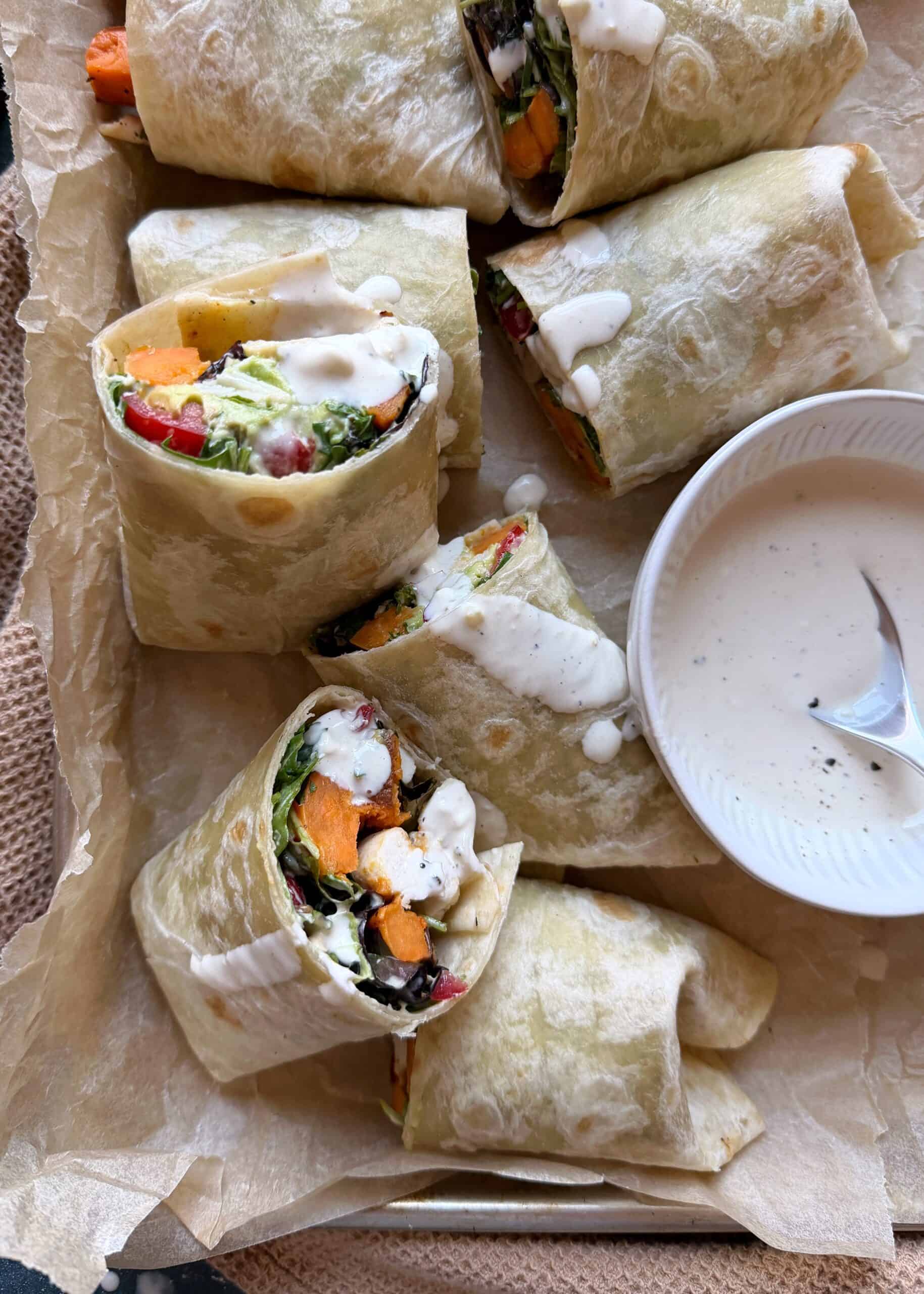 chicken caesar wrap with sweet potato tomato and avocado with extra dressing