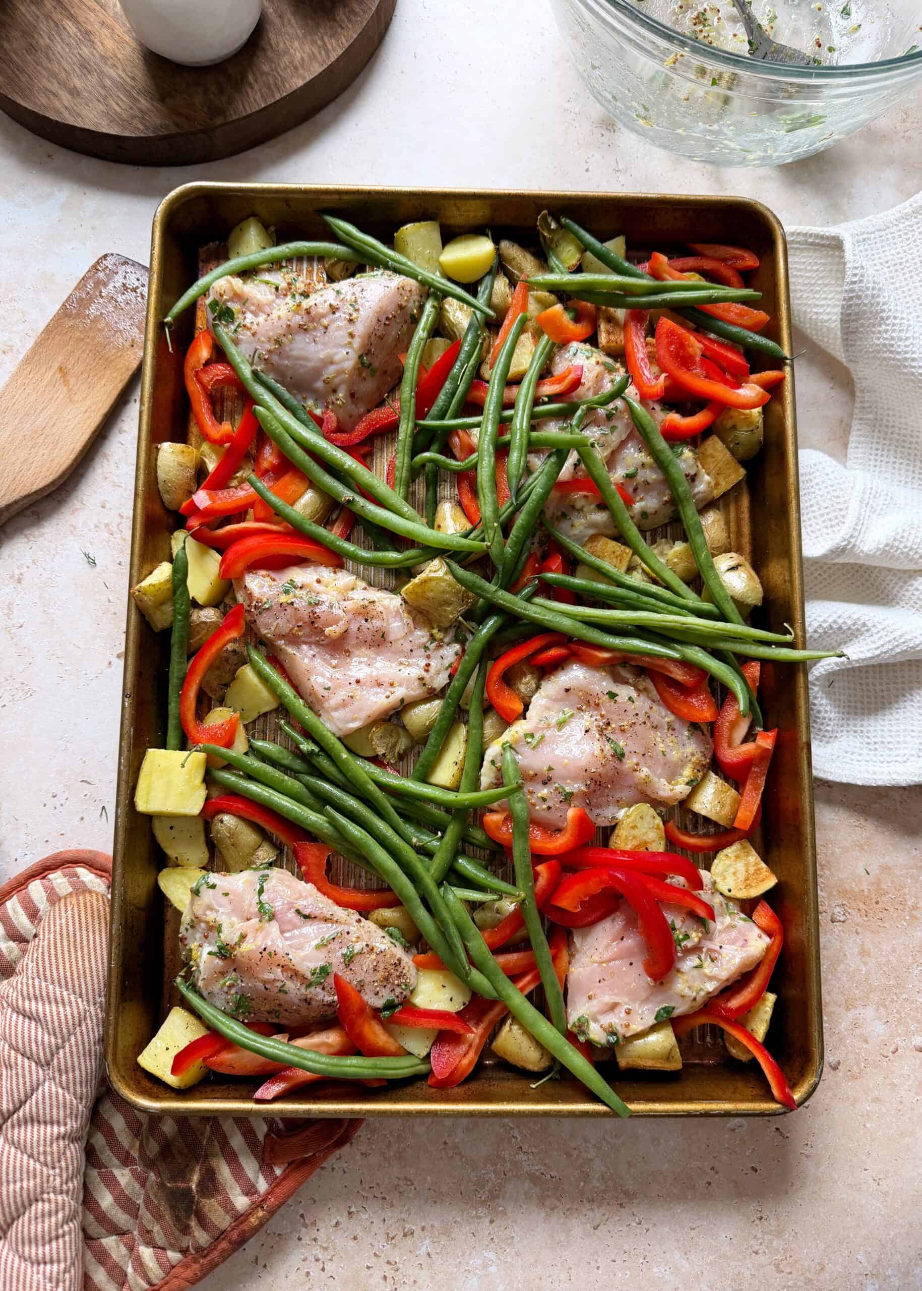 mediterranean sheet pan chicken on a sheet pan before baking