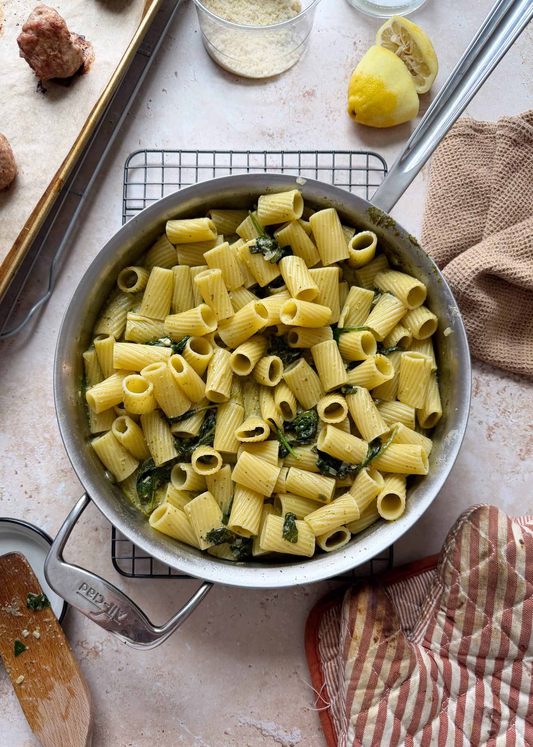 rigatoni with pesto sauce and wilted spinach