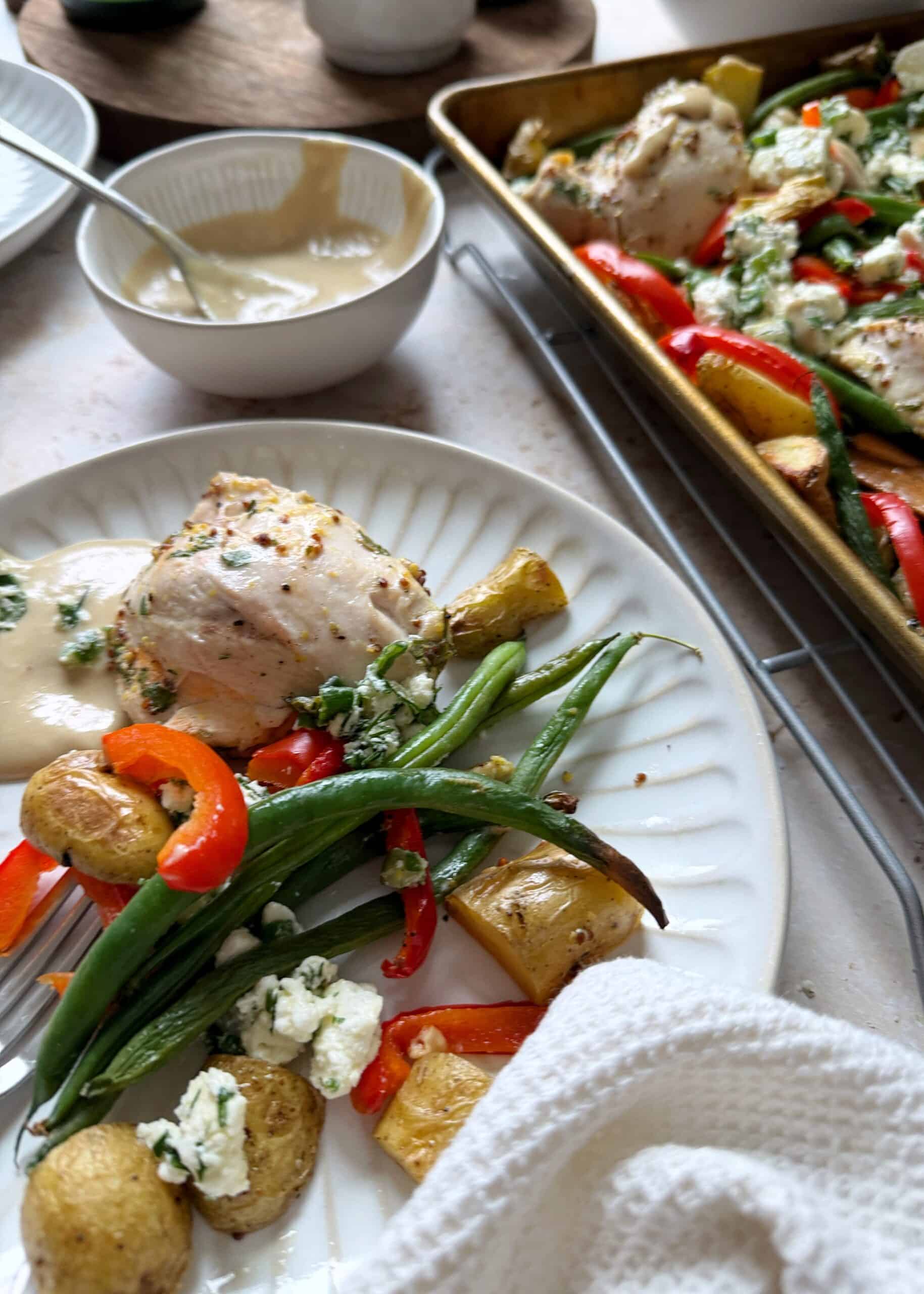 serving of mediterranean chicken and vegetables with feta salad