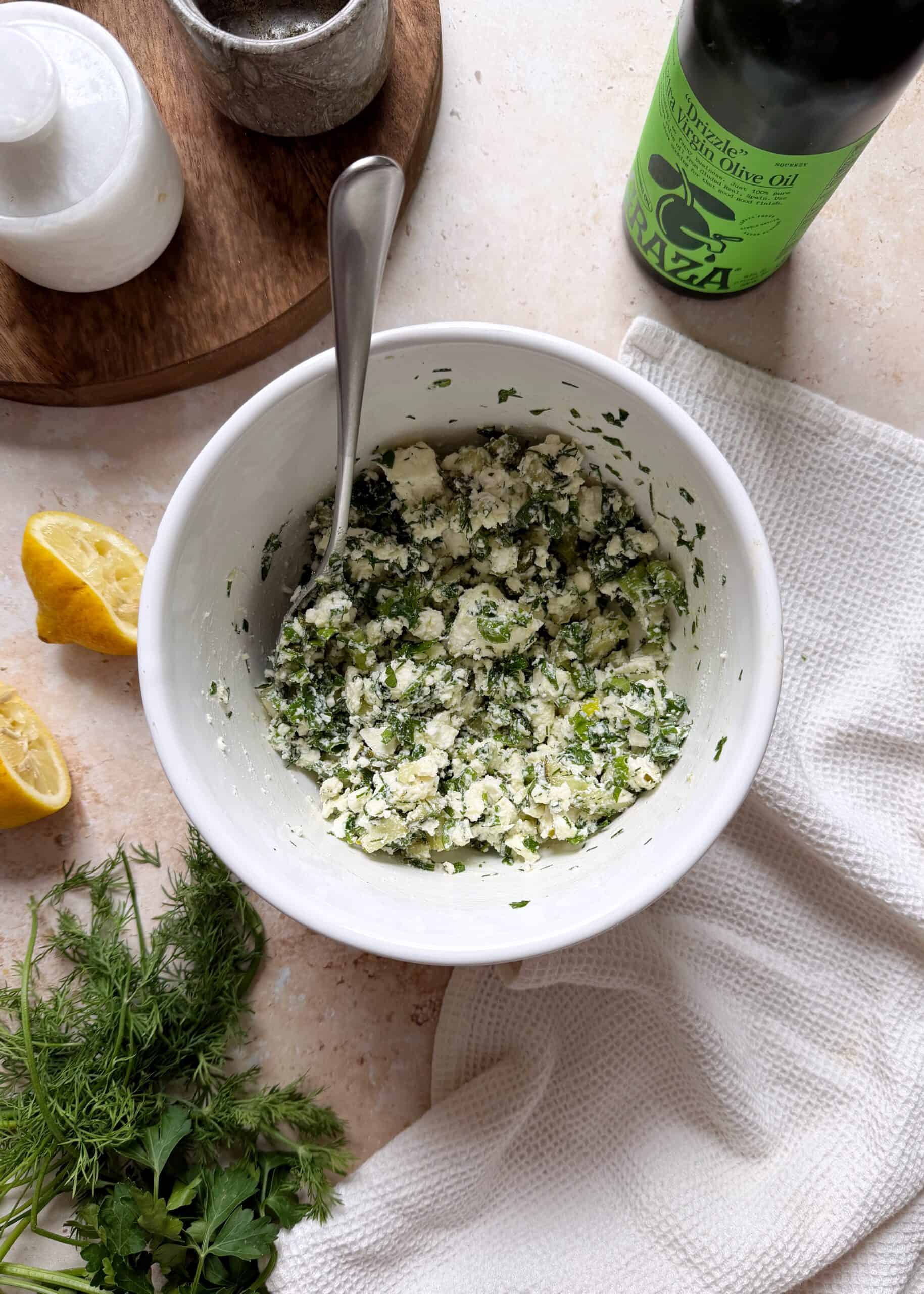 white mixing bowl with feta herb salad