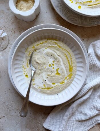 bowl of creamy roasted cauliflower and artichoke soup