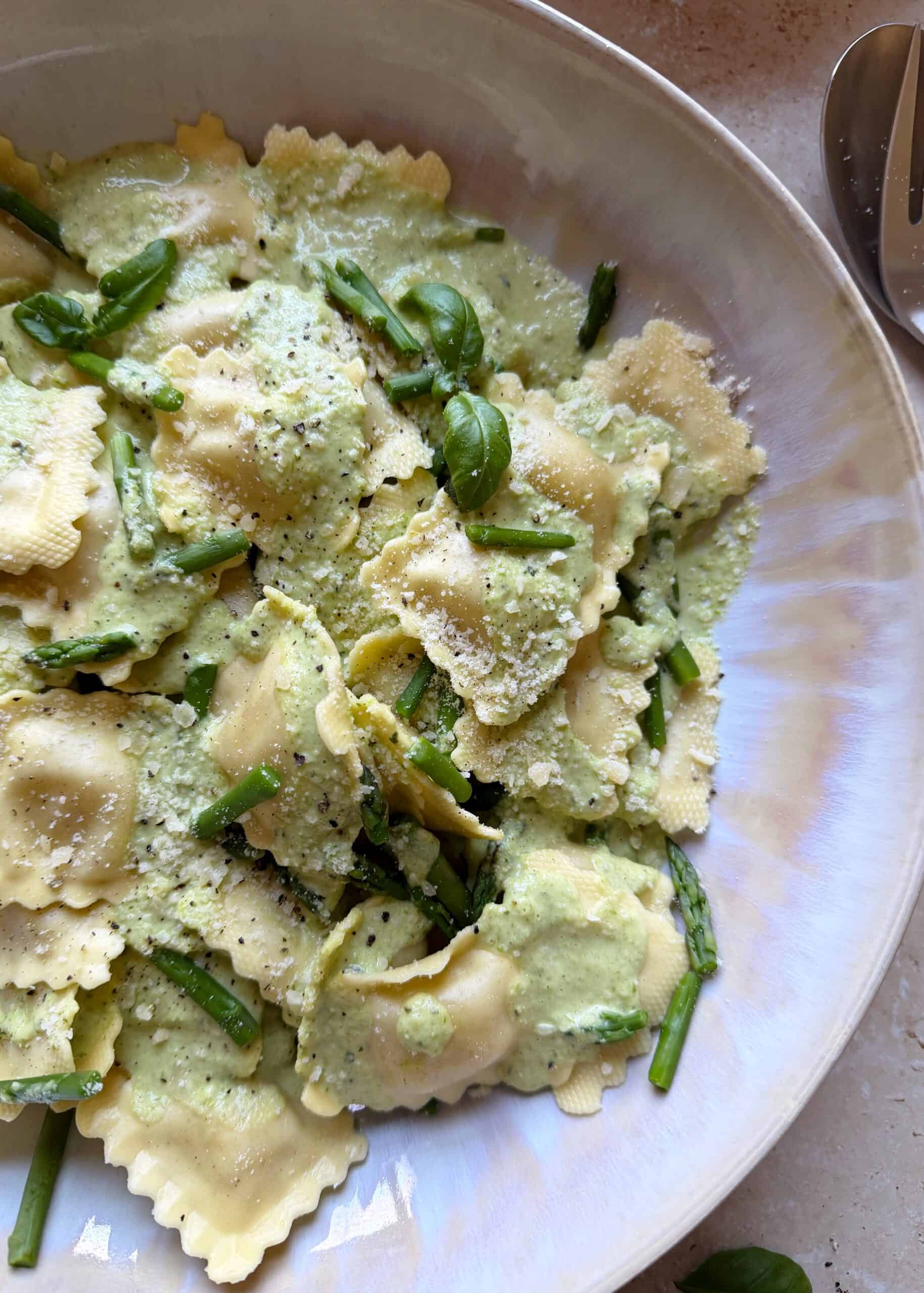 cheese ravioli with lemon asparagus cream sauce and basil