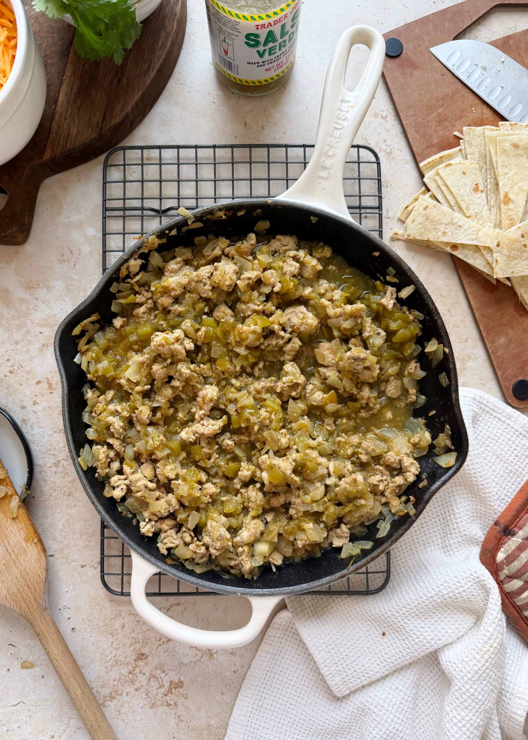 green chile chicken in a white skillet