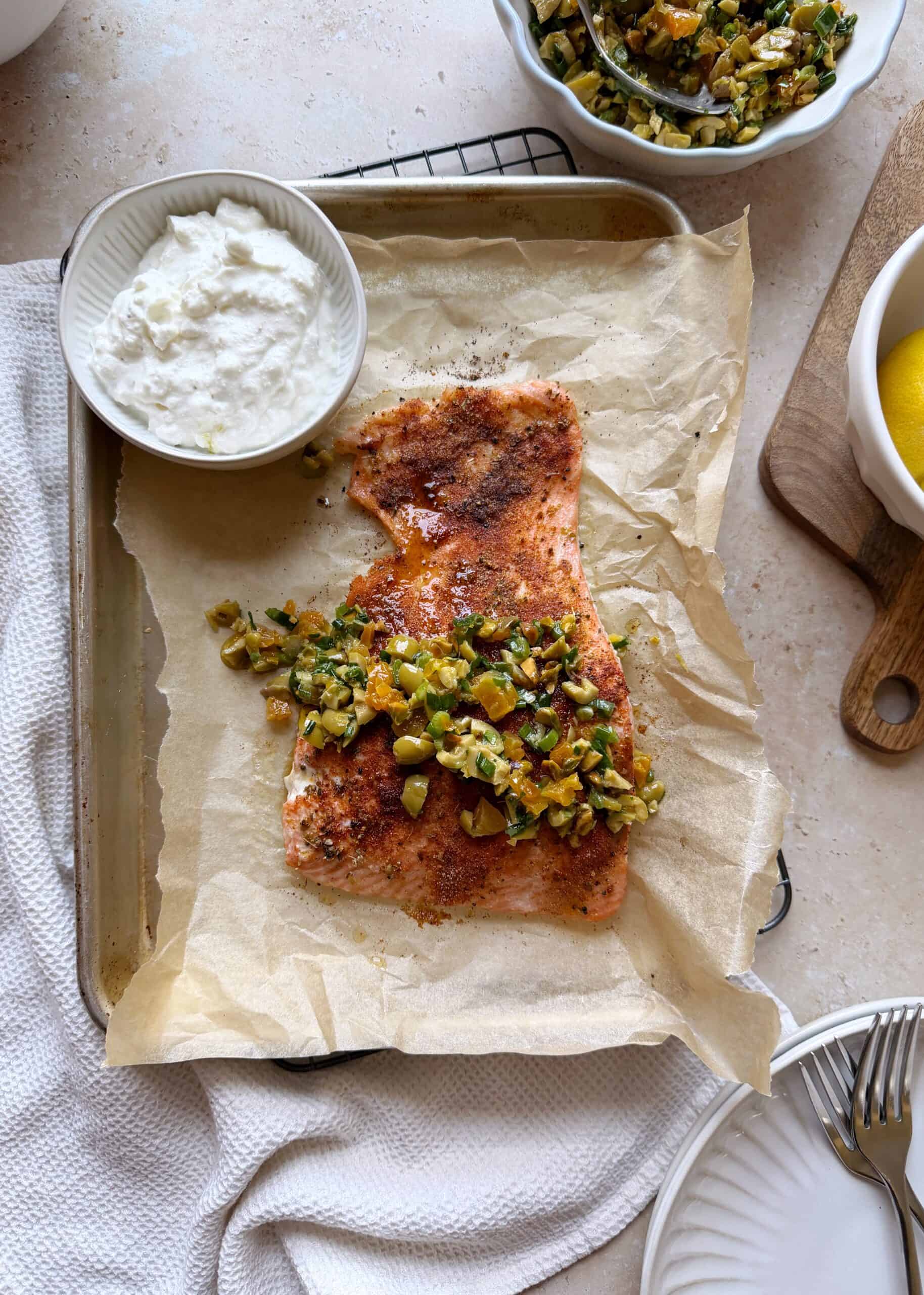 roasted salmon filet with olive apricot salad and feta sauce on the side