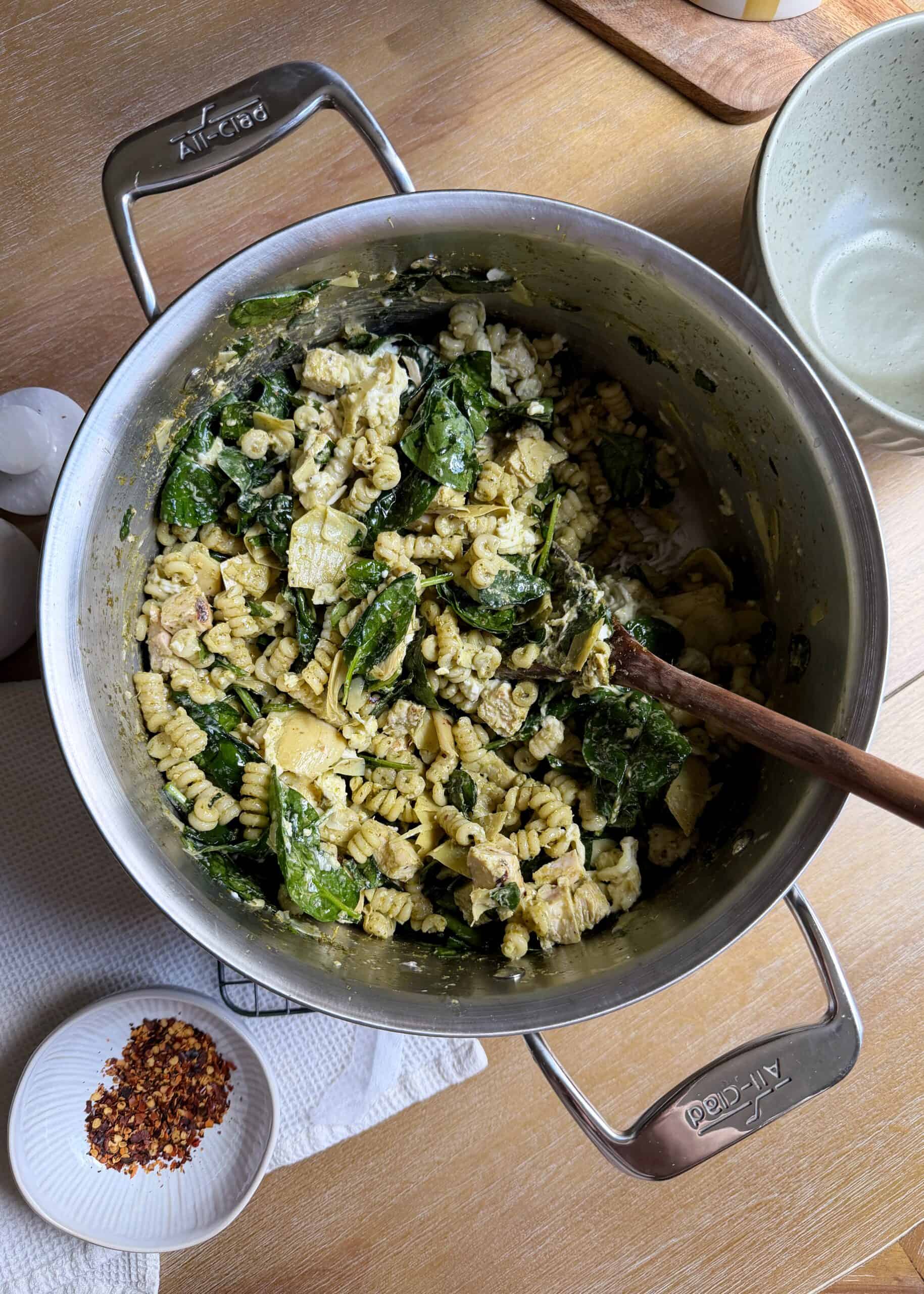one pot creamy spinach artichoke pasta on a cooling rack